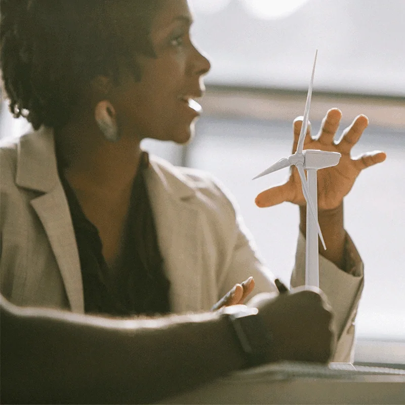 woman talking about wind turbine model