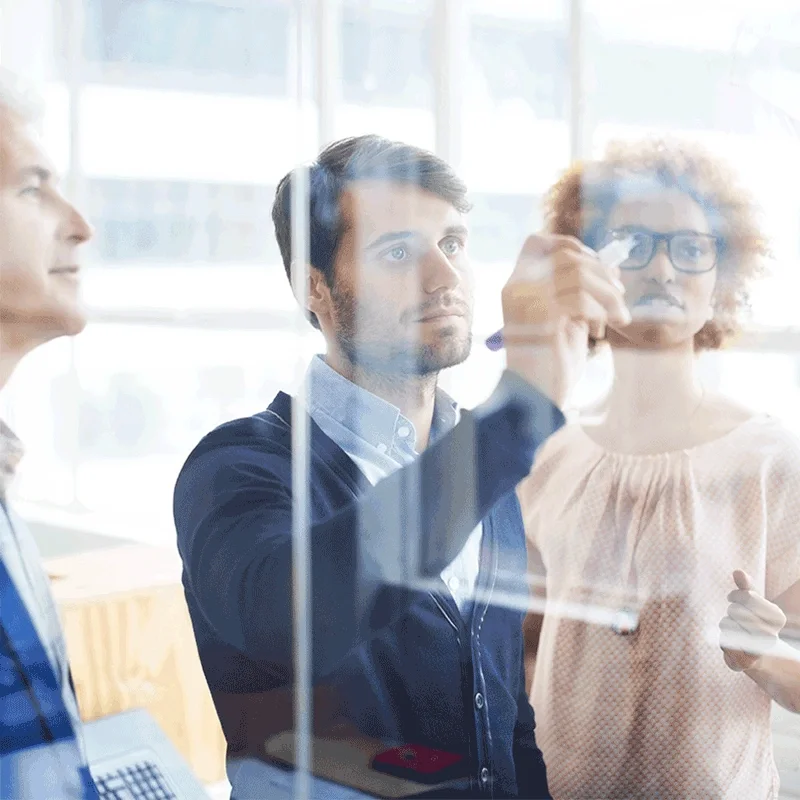 coworkers at whiteboard